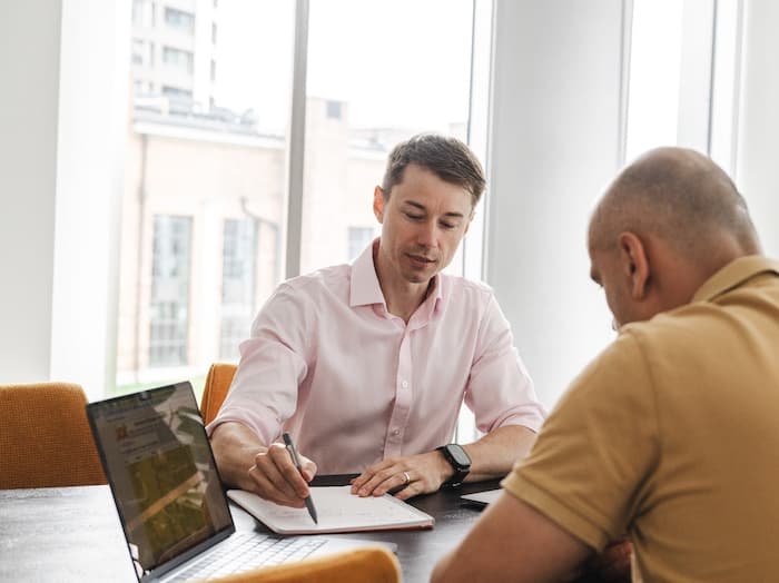Michal working hands-on with a client team on AI implementation
